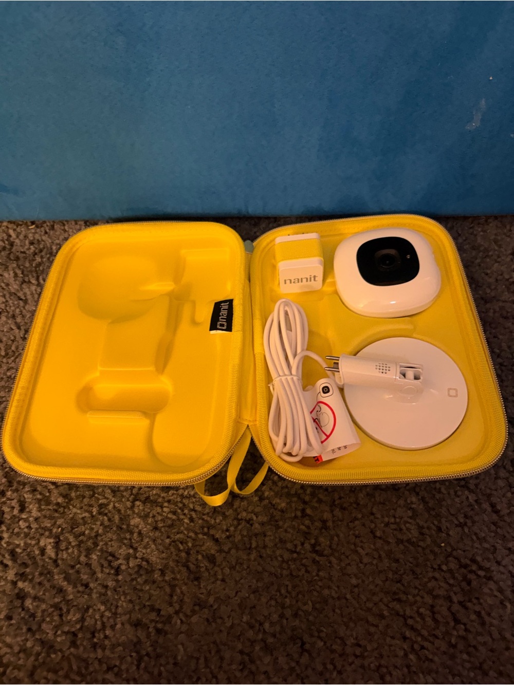 Nanit smart monitor with flex stand and yellow travel case